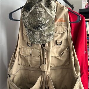 Tan Fishing Vest and Camouflage Cap